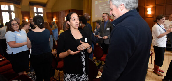 Two people conversing during a networking event